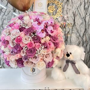 Toppe de rosas orquídeas globos y peluche